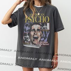 Inspired by the cult classic film starring Christian Bale, this American Psycho graphic t-shirt pays homage to one of the most famous horror films of all time. The American Psycho shirt features a bootleg streetwear style design with a bold oversized graphic and unique colors. This heavyweight movie t-shirt is a graphic of the 90s cult classic film American Psycho is printed on your choice of a standard t-shirt or a premium garment-dyed faded Comfort Colors 1717 t-shirt. Standard shirt colors: - Horror Graphic Print T-shirt For Fans, Patrick Bateman, Classic Film Stars, Bootleg Shirt, Retro Horror, Christian Bale, Streetwear Style, Movie T Shirts, Sand Beige