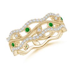 a yellow gold ring with emeralds and diamonds