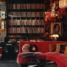 a living room filled with furniture and lots of records