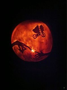 a pumpkin shaped like a person riding a bike