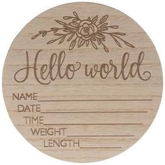 a wooden plaque with the words hello world on it and an image of a flower