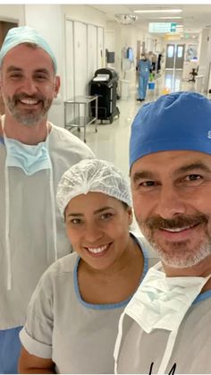 two men and a woman in scrubs are smiling at the camera while standing next to each other