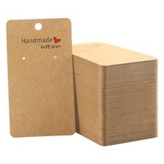 a stack of brown paper with the words handmade with love on it