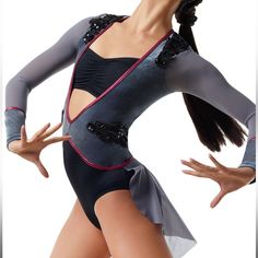 a woman in a leotard with her arms out