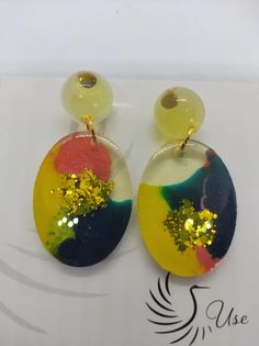 These handcrafted epoxy earrings are truly one-of-a-kind, featuring unique designs and intricate details. Despite their large size, they are incredibly lightweight, making them comfortable to wear all day long. Built to be durable, these earrings will withstand daily wear with ease--as long as they're not exposed to fire. Add a touch of sophistication to your style with these distinctive and elegant earrings. **Features - Handcrafted with care - One-of-a-kind design - Large but ultra-lightweight Epoxy Earrings, Elegant Earrings, Intricate Details, Warm Colors, Gift Baskets, Large Size, Different Colors, Jewelry Earrings Dangle, Daily Wear