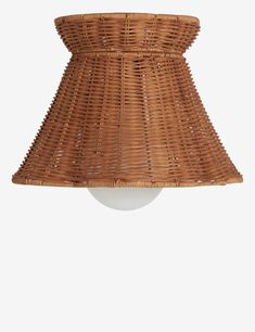 a lamp shade made out of wicker