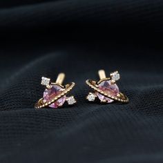 Product Details Elevate your style with these Stud Earrings. The mesmerizing blend of Pink Sapphire and Diamond adds a touch of celestial charm to any look, day or night. Product Information SKU SHP-EARRINGS112110839 Length 6.4 mm Width 6.5 mm Weight 0.80 gm (Approximate) PINK SAPPHIRE INFORMATION No.of Stones 2 Pieces Total Weight 0.68 Carat (Approximate) Dimension(approx) Round-4X4 mm-2 Pcs Color Pink Cut Brilliant Shape Round Setting Type Prong-Setting Quality Grade AAA DIAMOND INFORMATION No Rose Gold Celestial Earrings, Celestial Earrings With Diamond Accents For Anniversary, Celestial Yellow Gold Cubic Zirconia Earrings, Rose Gold Celestial Earrings For Gift, Planet Earrings, Pink Sapphire Earrings, Sapphire And Diamond Earrings, Birthstone Earring, Pink Gemstones