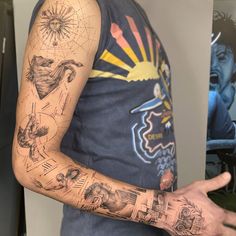 a man with many tattoos on his arm