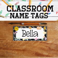 a classroom name tag on a desk with pencils and crayons around it