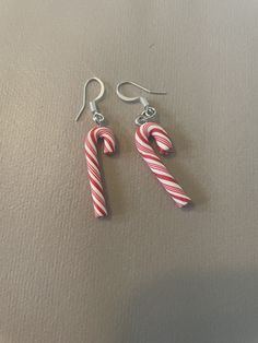 Candy cane earrings. Candy Cane Earrings, Completed Cross Stitch, Praying Hands, Candy Cane, Jewelry Earrings Dangle, Etsy Earrings, Dangle Drop Earrings, Dangle Earrings, Handmade Items