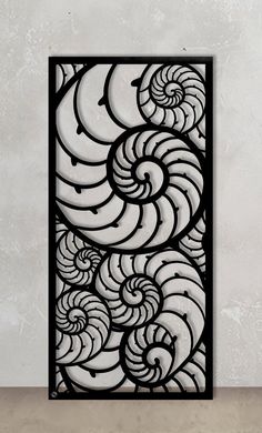 an art deco panel with black and white swirls