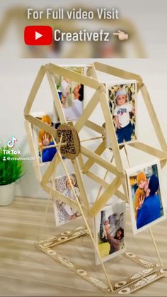 a wooden structure with pictures on it and the words for full video visit creativez