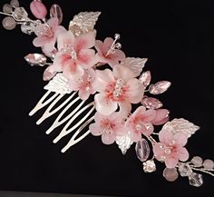 a hair comb with pink flowers and leaves