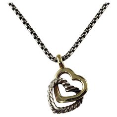 Vintage David Yurman Sterling Silver and 18 Karat Yellow Gold Double Heart Necklace- This romantic double heart necklace by David Yurman is crafted in beautifully detailed sterling silver and 18K yellow gold. Size: 16.5 inches (necklace) 13 mm x 11 mm (pendant) Weight: 7.2 gr./ 4.6 dwt. Hallmark: D.Y. 750 925 Very good condition, professionally polished. Will come packaged in a gift box or pouch (when possible) and will be shipped U.S. Priority Mail Insured. DV032023/17KCS Information regarding Double Heart Necklace, Double Heart, Big Sur, David Yurman, Heart Necklace, Priority Mail, Jewelry Necklace Pendant, Jewelry Necklaces, Yellow Gold