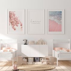 there are three pictures hanging on the wall in this baby's room with pink accents