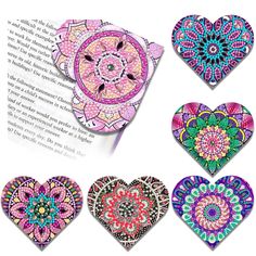 four heart shaped books with different designs on them