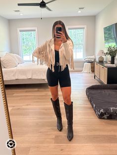 Fringe Jacket Concert Outfit, How To Style Fringe Jacket, Knee High Black Western Boots Outfit, Tan Fringe Jacket Outfit, Cowboy Boot Outfits Concert, Knee High Black Cowboy Boots, Tall Black Cowgirl Boots Outfit, Tall Black Western Boots Outfit, Black Knee High Cowboy Boots Outfit