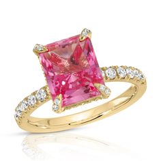 The radiant cut, cultured pink sapphire at the center of this playful ring represents the color of fiery passion for love and for life. A moissanite hidden halo and encrusted prongs offer just the right amount of sparkle to this feminine and charming ring. Made to order. Please allow 6-8 weeks for delivery.DETAILS:Center Stone: Type: Pink Sapphire (cultured) Size: 8 x 10mm (3.5ct diamond equivalent) Color: Pink Cut: Radiant Setting: Moissanite hidden halo and encrusted prongs 10K, 14K or 18K sol Pink Sapphire Engagement Ring, Engagement And Wedding Ring, Pink Sapphire Ring Engagement, Pink Sapphire Ring, Sapphire Engagement Ring, Hidden Halo, Personalized Gifts For Her, Radiant Cut, Sapphire Jewelry