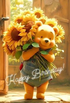 a teddy bear holding sunflowers in its arms and the words happy birthday written on it