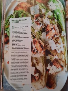 a plate with grilled romaine and cheese on it next to an open recipe book