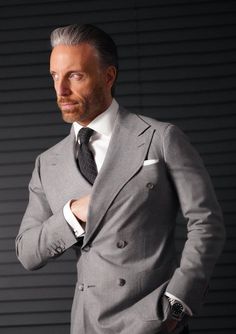 The perfect shade of stone grey defines this classic flannel suit. Tailored slim from soft, mid-weight wool flannel, this London cut suit features our signature double-breasted 2x6 button placement, double vents, patch pockets, natural shoulder, and wide peak lapels. The accompanying slim trousers are flat front with a wide waistband and feature our versatile side adjusters. Christopher Korey, Party Jacket, Light Grey Suits, Flannel Suit, Party Jackets, Tuxedo Blazer, Grey Flannel, Slim Fit Suits, Elegant Man