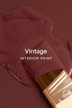 a close up of a paint brush with the words vintage interior paint on it