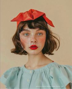 a woman with a red bow on her head