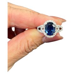 This gorgeous 18k white gold ring is set with a natural blue sapphire weighing 3.02 ct. It is surrounded with 66 round diamonds with a carat weight of 0.62. The diamonds boast a color or G/H and is SI1/SI2 in clarity. A beautiful ring to add to any jeweler's collection. Gia Certified Diamond Sapphire Ring, Sapphire And Diamond Ring, Sapphire Diamond Ring, Natural Blue Sapphire, White Gold Ring, Beautiful Ring, Natural Sapphire, Sapphire Diamond, White Gold Rings