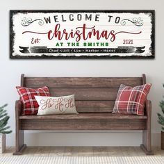 a wooden bench sitting in front of a white wall with christmas decorations on it and the words welcome to christmas at the smiths