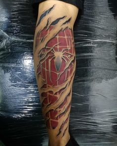 a man with a spiderman tattoo on his leg