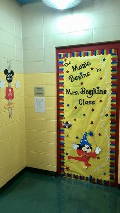 this is a classroom door decorated with mickey mouse and mrs boffins class decorations