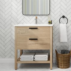 a bathroom vanity with white towels and a wooden cabinet under a mirror on the wall