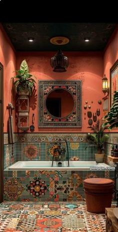 the bathroom is decorated with colorful tiles and potted plants on the wall, along with a large mirror above the bathtub