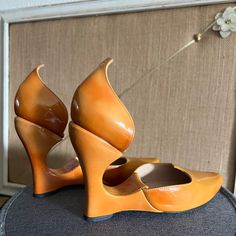 Authenticity Guaranteed! Great Condition With Light Wear. Please Check Out The Pics. Color Is A Brown/Tan With Orange Tones. Size Is 36.5 Eu, Which Is Roughly Size 6.5 Us. Orange Leather Heels With Sculpted Heel, Luxury Orange Leather Shoes, Orange Open Toe Leather Heels, Orange Leather Open Heel Heels, Luxury Orange Patent Leather Heels, Orange Brown, Louis Vuitton Shoes, Wedge Heels, Patent Leather