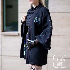 Introducing our black techwear-style kimono jacket, meticulously crafted from top-quality materials, and elevated with mesmerizing holographic accents that make it stand out from the crowd. Each of these kimono jackets is handcrafted in our workshop, where we pay meticulous attention to every tiny detail, ensuring flawless quality. They are available in a single size, designed to fit everyone perfectly, from S to XL. Please note that for handmade items, production time may vary, and it could tak Black Outerwear With Kimono Sleeves For Winter, Black Winter Outerwear With Kimono Sleeves, Black Rave Outerwear For Winter, Rave Style Black Winter Outerwear, Black Harajuku Style Cosplay Outerwear, Oversized Black Outerwear With Kimono Sleeves, Black Long Sleeve Samurai Kimono, Black Long Sleeve Kimono For Winter, Oversized Black Kimono For Winter