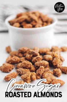 cinnamon sugar roasted almonds in a white bowl with the title overlay reads, cinnamon sugar roasted almonds