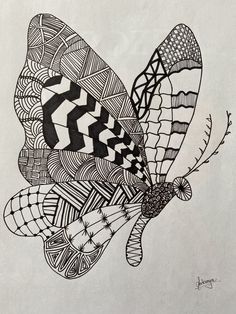 a black and white drawing of a butterfly with geometric designs on it's wings