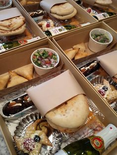 several boxes filled with different types of food