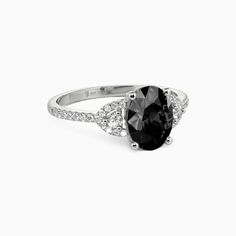 a black and white diamond ring on a white background