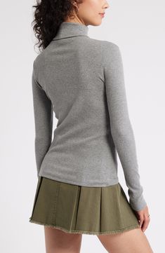 This sleek and simple ribbed top fits seamlessly into your wardrobe, whatever your personal style may be. 24" length (size Medium) Turtleneck Long sleeves 58% cotton, 38% polyester, 4% spandex Machine wash, tumble dry Imported Women's Clothing Not available for sale and shipment to Germany Gray Cotton Top With Ribbed Neckline, Spring Turtleneck Top With Ribbed Cuffs, Ribbed Fitted Long Sleeve Top, Solid Ribbed Fitted Long Sleeve Top, Solid Color Cotton Knit Top With Ribbed Neckline, Cotton Knit Top With Ribbed Neckline, Stretch Ribbed Tops For Layering, Gray Ribbed Top For Fall, Gray Stretch Tops With Ribbed Neckline