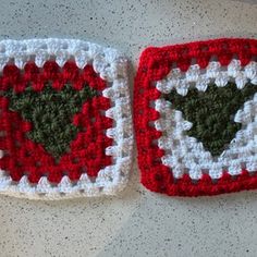 two crocheted squares with hearts on them