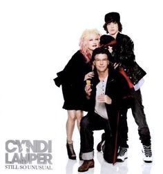 a group of people standing next to each other in front of a white background with the words cyndi laver still so unusual