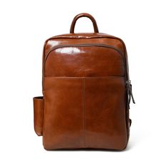 Make a bold statement with this head-turning Italian brown leather backpack that radiates confidence and style. The glossy finish enhances its vibrant color, creating a mesmerizing and eye-catching accessory. The sleek design and luxurious feel of the leather makes it a standout piece in any fashion ensemble, promising to elevate your look with a touch of glamour. Whether you're navigating city streets or making a grand entrance at an event, this bold and eye-catching brown leather backpack is t Modern Brown Leather Backpack With Leather Lining, Modern Brown Backpack For On-the-go, Modern Travel Bags With Glossy Finish, Modern Glossy Travel Bag, Modern Glossy Finish Travel Bags, Luxury Brown Backpack With Leather Backing, Leather Bags With Glossy Finish For Daily Use, Daily Use Leather Bags With Glossy Finish, Classic Glossy Travel Bag