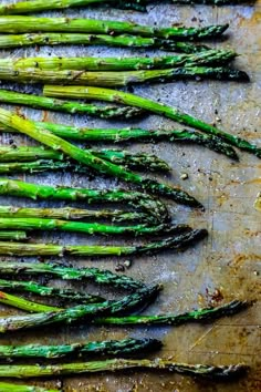 asparagus on a baking sheet ready to be cooked in the oven for dinner