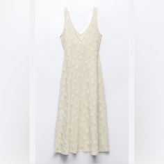 V-Neck Midi Dress With Straps. Raised Textured Fabric. Detail. Item Code: 4770/450. Zara V-neck Midi Sundress, Zara Elegant V-neck Dress For Spring, Beige V-neck Sleeveless Sundress, Beige V-neck Sundress Sleeveless, Elegant Zara V-neck Dress For Spring, Zara V-neck Sundress Maxi Dress, Zara Sundress Maxi Dress With V-neck, Zara Sundress With V-neck, Zara V-neck Sundress