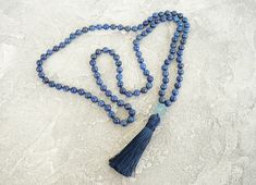 Lapis Lazuli Mala Necklaces for Women Men 108 Mala Necklace Blue Bead Hand Knotted Long Necklace Yoga Meditation Jewelry Tassel Necklaces - 8mm Natural Blue Lapis Lazuli 108 beads - 12 mm Blue Agate Guru bead - 9cm Dark Blue Tassel Lapis lazuli is a stone with royal energy, in that it helps you uncover and access your inner noble and Divine nature. It activates psychic abilities and intuition, connecting you to spiritual guidance and visionary awareness. It helps you discern and speak the truth, Blue Polished Beads Spiritual Crystal Necklace, Blue Spiritual Crystal Necklace With Polished Beads, Spiritual Blue Crystal Necklace With Polished Beads, Adjustable Blue Necklaces With 8mm Beads, Blue Adjustable Necklace With 8mm Beads, Adjustable Blue Necklace With 8mm Beads, Blue Necklaces With 8mm Beads For Jewelry Making, Blue Round Beads Crystal Necklace For Meditation, Blue Necklaces With 8mm Beads As A Gift