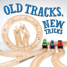 a wooden train set with cars and tracks in front of the words old tracks, new tricks