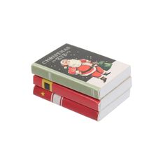 three books stacked on top of each other with santa's helper written on them