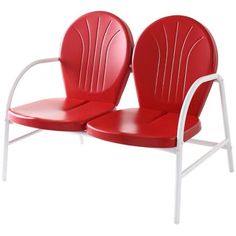 two red and white chairs sitting next to each other