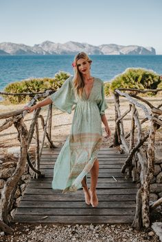 We have a special 10€ gift discount for the first subscribers to our NEW newsletter !   Please copy and paste the link to sign up : www.bit.ly/MKSnews    Sea Green Boho Silk Summer Dress BORA BORA DRESS This dress will make you feel like a goddess in all situations ! This Silky Caftan , 70% silk and 30% polyester mix material , style dress is the perfect, elegant  wear that you can take to the beach or to wedding , depending on your accessories.  Its shape enhances all body shapes with a gorgeous long lean figure.  It is the perfect Resort , Holiday wear and is also very practical for your vacations.  Its light weight poly-silk fabric never wrinkles and it does not need and ironing ! Never ! its a total blessing ! out of the washing machine ready to wear !   It has large wide sleeves, tied Beach Outfits Women Vacation Resort Wear, Beach Outfits Women Vacation, Summer Kaftan, Silk Summer Dress, Elegant Wear, Dress Kaftan, Holiday Wear, Boho Green, Sleeves Dress